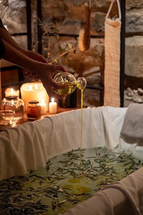 Soothing bath with botanicals and body oils